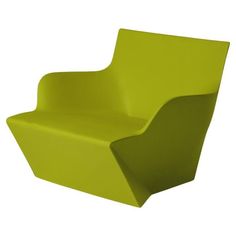 a lime green chair sitting on top of a white floor