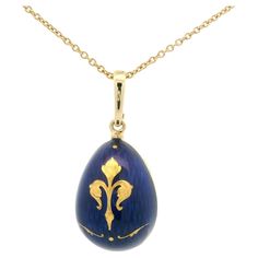 Fabergé egg-shaped pendant necklace, 18k yellow gold, translucent blue enamel with fleur de lys paillon, limited edition. Reference: F1589/BL/00/01/102 _V1712/00/00/00/10250 Brand: Faberge Workmaster: Victor Mayer Material: 750/- yellow gold (18k) Shape: egg pendant Vitreous enamel: Translucent royal blue Paillons: five yellow gold paillons, a >fleur de lys< as the central motif. Limited edition: 500 pieces Individual number: 31 / 500 Chain: 50cm 18K yellow gold chain (V1712/00/00/00/10250) by V German Jewelry, French Royalty, Military Insignia, Vitreous Enamel, Historical Jewellery, Luminous Colours, Iris Flowers, Modern Necklaces, Yellow Gold Chain