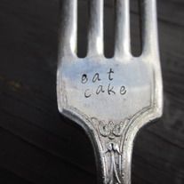 a fork with the words eat cake written on it