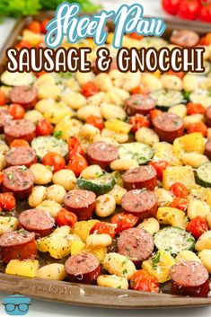 sausage and gnocchi on a sheet pan with tomatoes, zucchini, and parsley