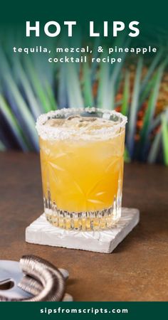 a cocktail sitting on top of a wooden table