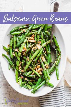 balsamic green beans in a white bowl with a spoon and napkin on the side