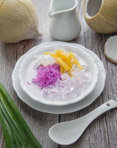 a plate with some food on top of it next to garlic and other items that include onions