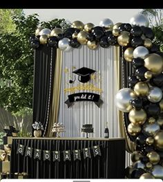 a graduation party with balloons and decorations