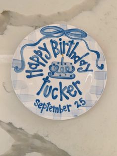 a birthday plate with the words happy birthday tuckers on it