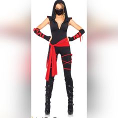 a woman in a black and red costume is standing with her hands on her hips