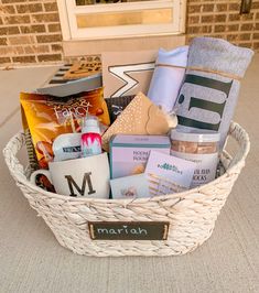 a basket filled with personal care items sitting on top of a floor next to a door