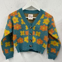 Floral Printed, Button Down Cardigan And Cropped Tank Set In Aqua For Girls Sized 8-14. Comes With Cardigan And Tank Top. Brand New, In Polybag, Never Worn. Cute Spring Cardigan For School, Playful Yellow Sweater For Fall, Blue Retro Cardigan With Buttons, Retro Blue Cardigan With Buttons, Playful Yellow Sweater For Spring, Yellow Retro Cardigan For Spring, Yellow Buttoned Sweater For Fall, Retro Yellow Cardigan For Spring, Yellow Sweater With Button Closure For Spring