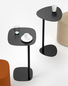 three tables with cups and saucers sitting on top of each other in different colors