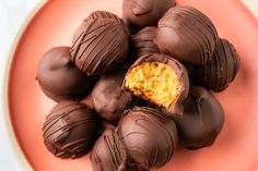 a plate filled with chocolate covered candies on top of a table