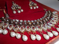 "Please see our art offerings at www.etsy.com/shop/vintageartsales Vintage gold plated rhinestone and faux pearl necklace and earring set. Bollywood style.Glamorous and showy for evening wear or costume. Very well made. Has additional parts for future repairs if needed. Cord on necklace is silk and slides to adjust length. Post chandelier earrings. Measurements: Adjustable cord max length 26\", Pendant drops 2\" from cord. Earrings 2.75\"l x 1.25\"w Mark: none, card in box \"DeVita for Ava Mater Costume Jewelry Sets With Rhinestones For Gifts, Gold Bridal Necklace With Bling As Gift, Gold Jewelry Sets With Rhinestones As Gifts, Jeweled Jewelry Sets For Gift, Vintage Jewelry Sets For Weddings And Festivals, Costume Jeweled Bridal Necklace As Gift, Vintage Jewelry Sets For Wedding And Festivals, Jeweled Costume Bridal Necklace Gift, Costume Bridal Necklace As Gift