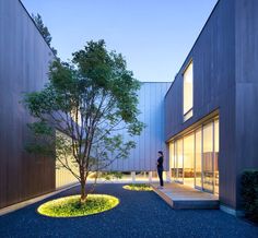 a person standing in the middle of a courtyard