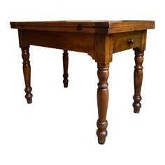 an old wooden table with two legs and a drawer on one end, against a white background