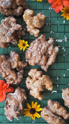 there are some cookies and flowers on the cooling rack