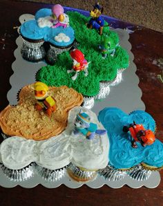 there are cupcakes that have been placed on the table for someone's birthday