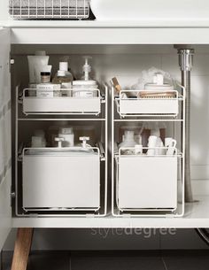 an open cabinet filled with lots of white containers