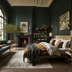 a bedroom with dark green walls and wood flooring, a fireplace in the corner