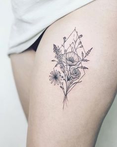 a woman's thigh with flowers and geometric shapes on the back of her thighs