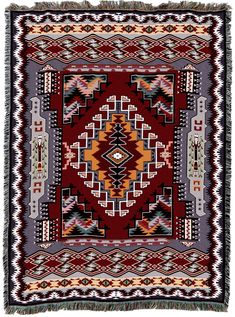 a red and yellow rug with fringes on the bottom, in an ornate pattern