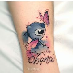 a small tattoo on the leg of a person with a pink butterfly flying over it