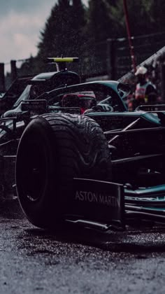 an image of a race car in the rain