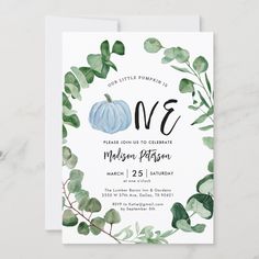 a white card with green leaves and a blue pumpkin