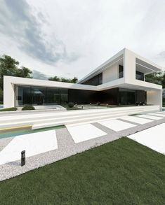 an artistic rendering of a modern house with pool and grass in the foreground, on a cloudy day