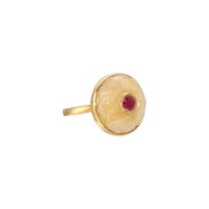 A stylish ring featuring a beautifully carved yellow cabochon Sapphire dome set with a pink Ruby which has been encased in a 'Kundan' style gold setting. - Natural Yellow Sapphire weight approx 15 Carats. - Magenta Pink Ruby weight approx 1.10 Carats, encased in 22 Karat Gold. - Set in an 18 Karat Gold band. - Diameter approx 21mm Depth approx 11mm. Gold Ruby Ring With Domed Shape, Gold Domed Ruby Ring With Gemstone, Yellow Gold Round Cabochon Enamel Ring, Yellow Gold Round Enamel Ring With Gemstone, Yellow Gold Enamel Ring With Cabochon, Yellow Gold Enamel Cabochon Ring, Yellow Gold Cabochon Enamel Ring, Enamel Cabochon Ring, Unique Round Cabochon Ruby Ring