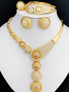 Afraic Jewelry -Dubai Gold Color Jewelry Set Hollow Round Ball Large Pendant Necklace Earring Ring Bracelet Set Women's Wedding Party Gift product name: Latest jewelry set designs for women material: Zinc alloy keyword: Dubai Gold Color Jewelry Set Skeletonized Round Ball Large Pendant Necklace Earring Ring Bracelet Set Style: Colorful Dubai Gold Color Jewelry Set For Women Style: TRENDY Shape\pattern: Round Plating color: Gold Plating Origin: Mainland China Occasion: wedding Model Number: 233 Metals Type: Zinc alloy Material: Metal Jewelry Sets Type: Necklace/Earrings/Ring/Bracelet Item Type: Jewelry Sets Included Additional Item Description: Necklace Earring Ring Bracelet Set Gender: Women Model Number:3256804082242651 Product information: Material: Zinc alloy Color: Gold Color Product P Costume Jewelry Metal Bridal Sets, Adjustable Gold Bridal Sets As Gift, Adjustable Gold Bridal Sets For Gifts, Gold Crystal Jewelry Sets, Gold Crystal Bridal Sets For Gift, Gold Crystal Bridal Sets, Gold Adjustable Bridal Sets, Adjustable Gold Bridal Sets, Round Alloy Costume Jewelry