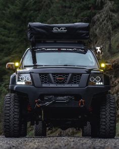 the front end of a truck with its lights on