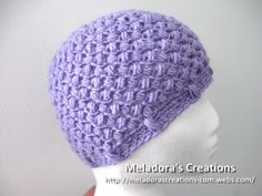 a crocheted hat is shown on a mannequin head