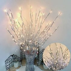 a vase filled with lots of lights on top of a wooden table next to a mirror