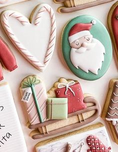 decorated cookies are arranged in the shape of santa's sleigh and presents