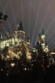 lights shine on the castle at night