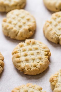 several cookies on a baking sheet ready to be baked