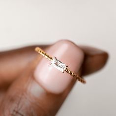 This baguette ring features a twisted gold band and a baguette cut gemstone at its center.  The center gemstone measures 5mm x 2.5mm.  Made with cubic zirconia.  Size: 5, 6, 7, 8, 9 Wedding Rings For Petite Hands, Promise Ring Gold Simple, Small Baguette Ring, Gold Ring Gemstone, Promise Rings For Her Simple, Rings Preppy, Cute Simple Rings, Baguette Ring Engagement