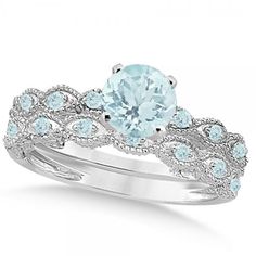 an aqua blue topazte and diamond bridal ring with matching wedding band set