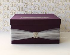 a purple box with a white bow on it