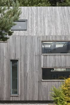 an exterior view of a house with wood siding