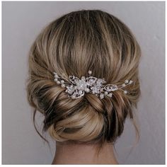 a woman with blonde hair wearing a wedding hairstyle