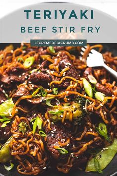 beef stir fry with broccoli and sesame seeds in a black bowl on top of a white table