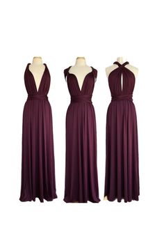 three dresses on mannequins, one in purple and the other in maroon