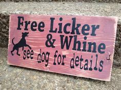 a wooden sign that says free licker and wine see dog for details