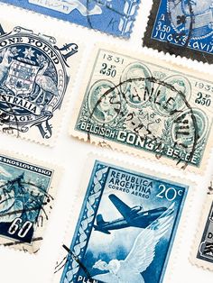 four different stamps with the same image on them, all in blue and white colors