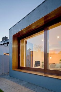 an open window on the side of a house