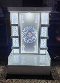 an illuminated display case with the letter g on it