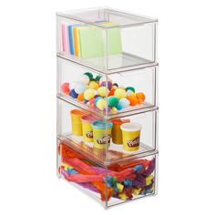 three tier acrylic storage bins filled with confetti and pom - poms