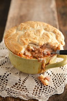 a pot pie sitting on top of a wooden table