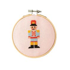 a cross stitched picture of a nutcracker