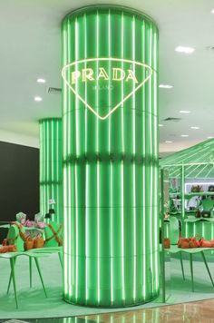 the interior of a retail store with green lighting